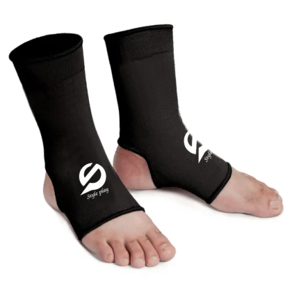 Black Shin Instep Pad Lockdown providing foot and shin protection for MMA and Muay Thai training